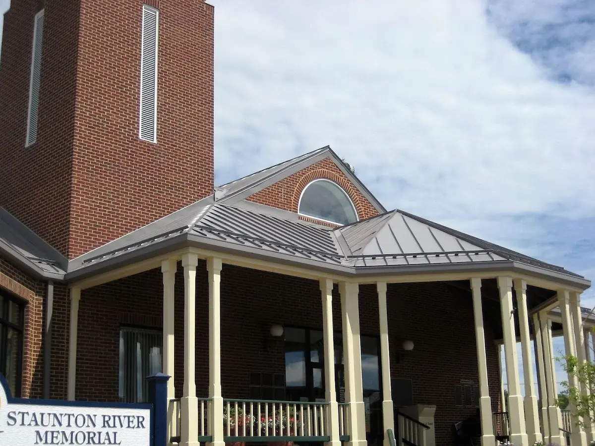 Skilled roofing craftsmen working on a residential roof in Jesup